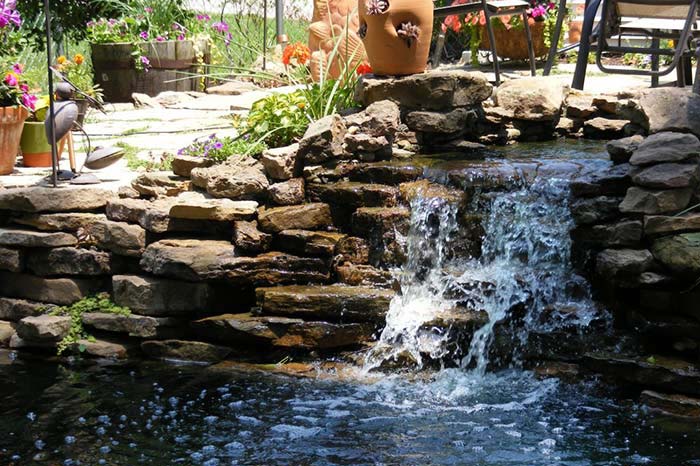 A water fall in backyard of a St. Louis home